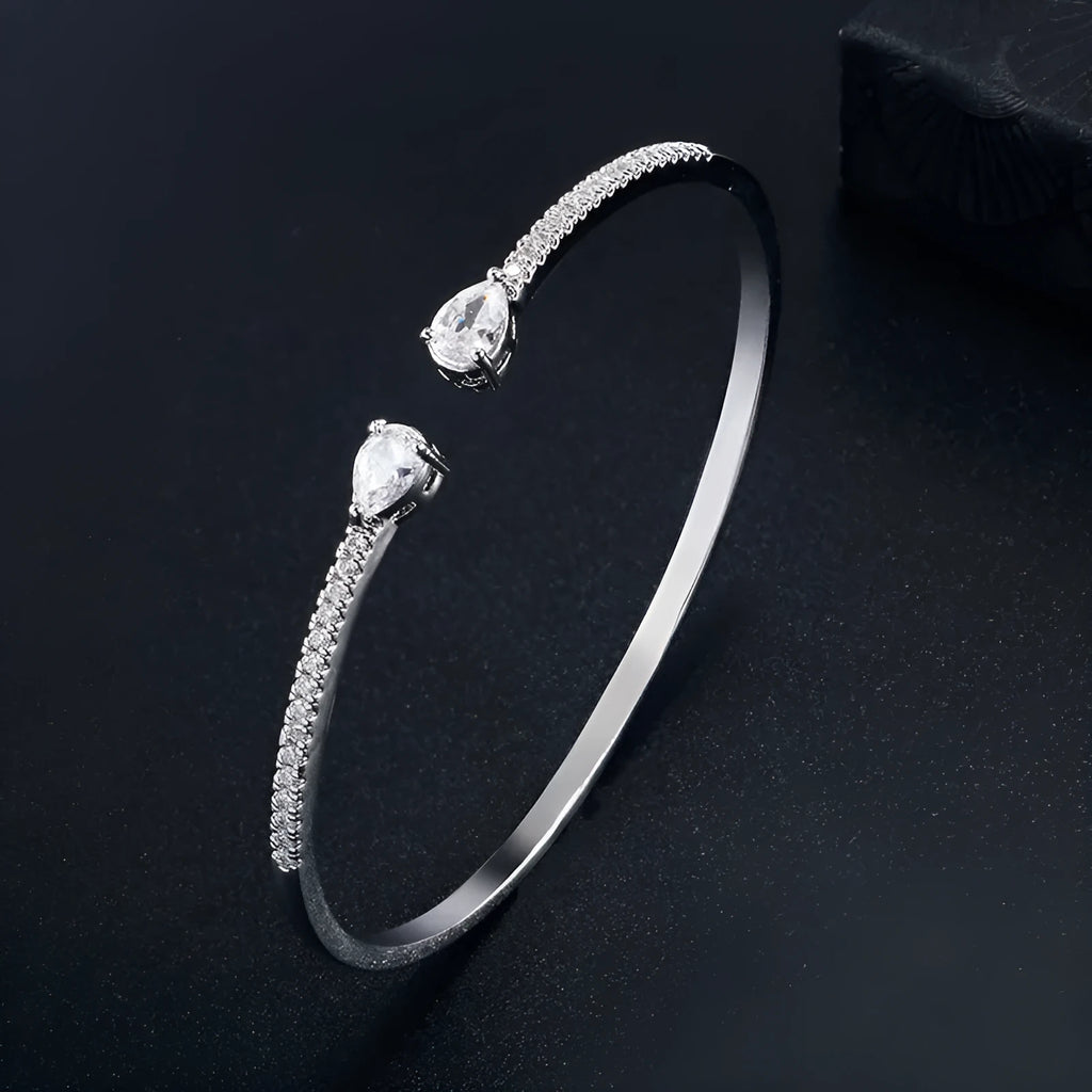 Multi-zircon bracelet with inlaid design on copper material in white or blue colour