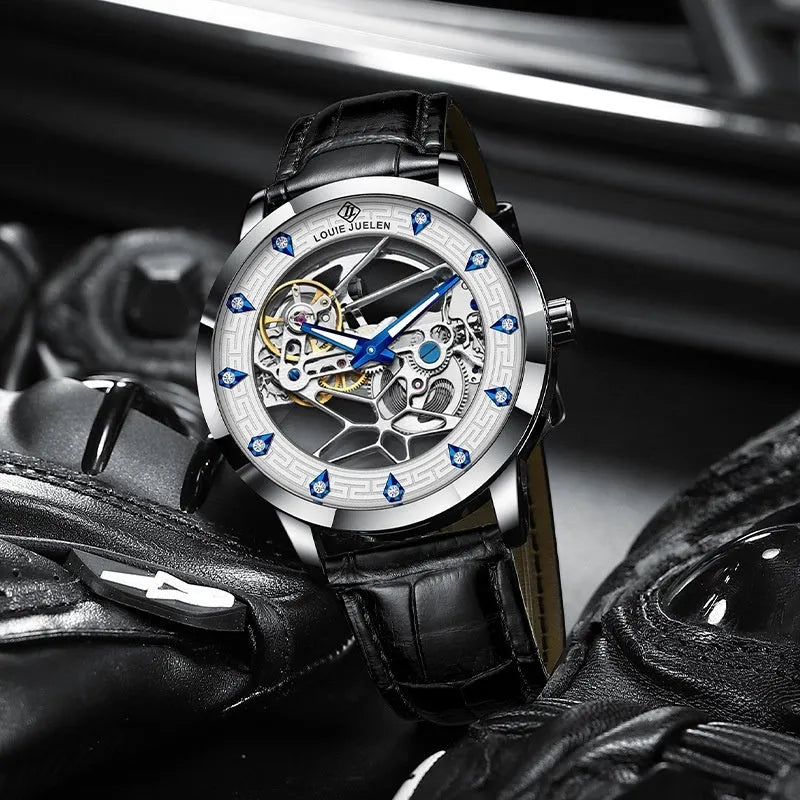 Silver men's mechanical watch with white dial, blue luminous hands, and a black leather strap.
