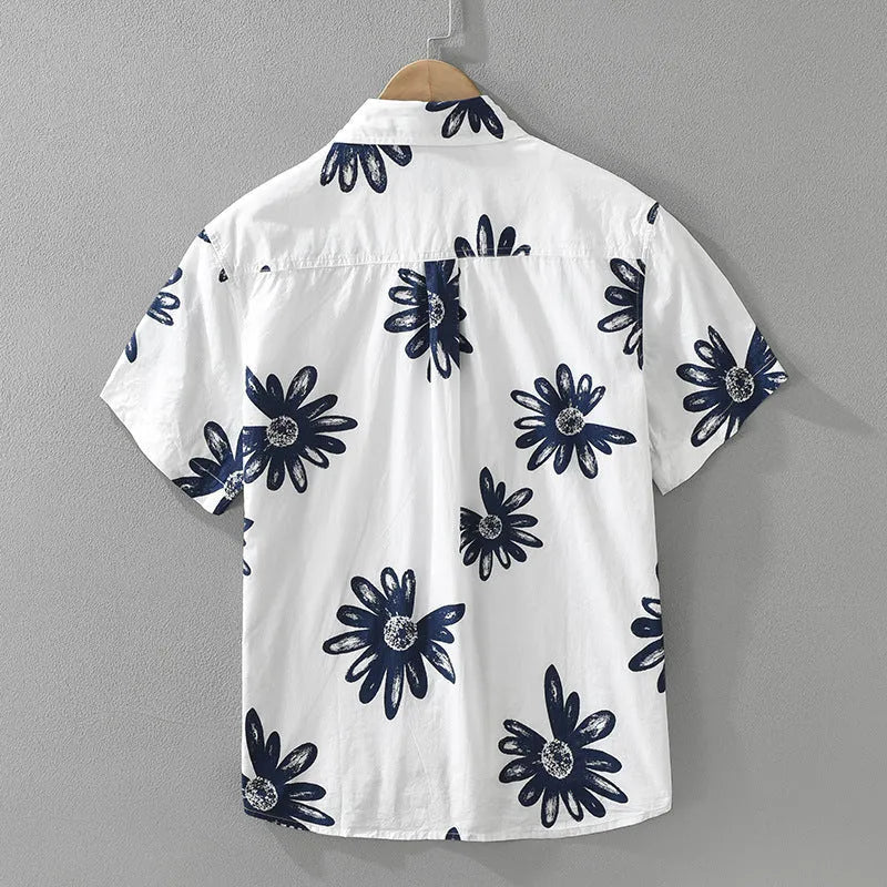 White loose-fit short sleeve cardigan shirt hanging, showing its oversized Japanese style.