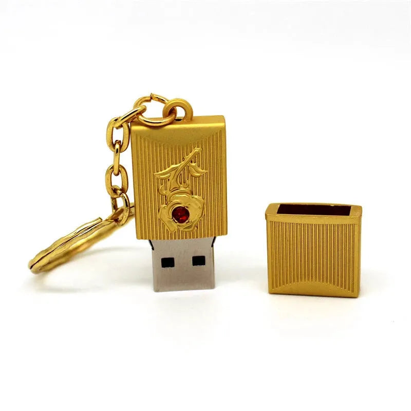 Metal and crystal USB flash drive in gold finish with decorative crystal front on white background