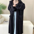 Women's loose grey hooded longline acrylic cardigan coat with raglan sleeves laid flat