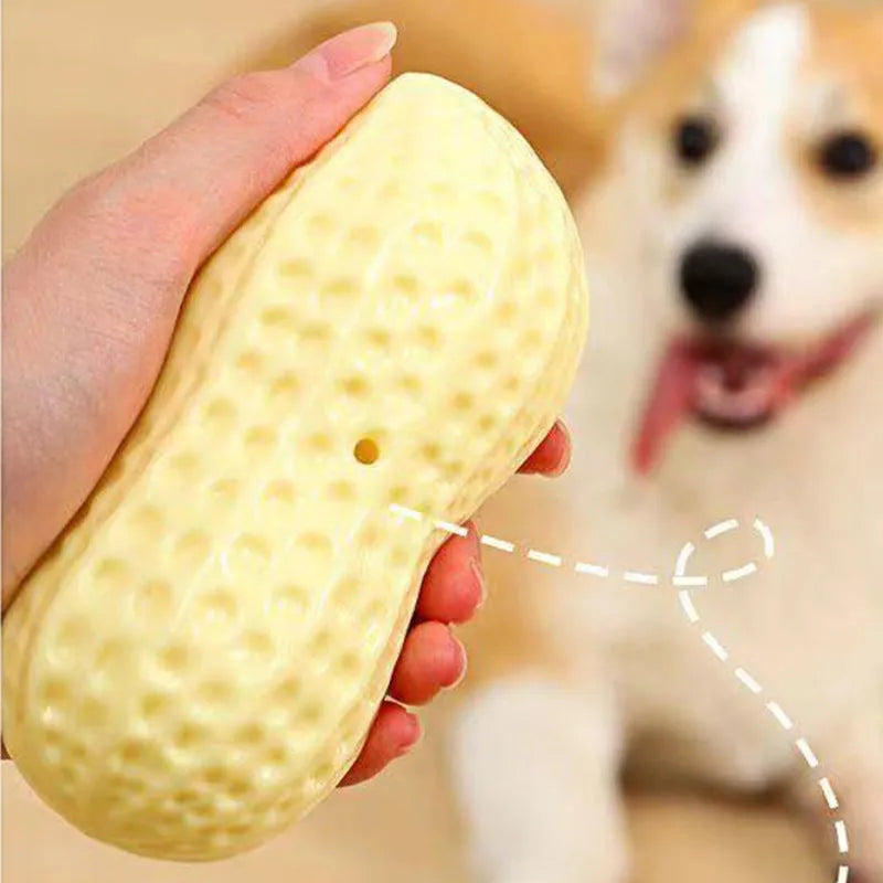 Yellow TPR peanut-shaped dog chew toy with textured surface for teeth cleaning.