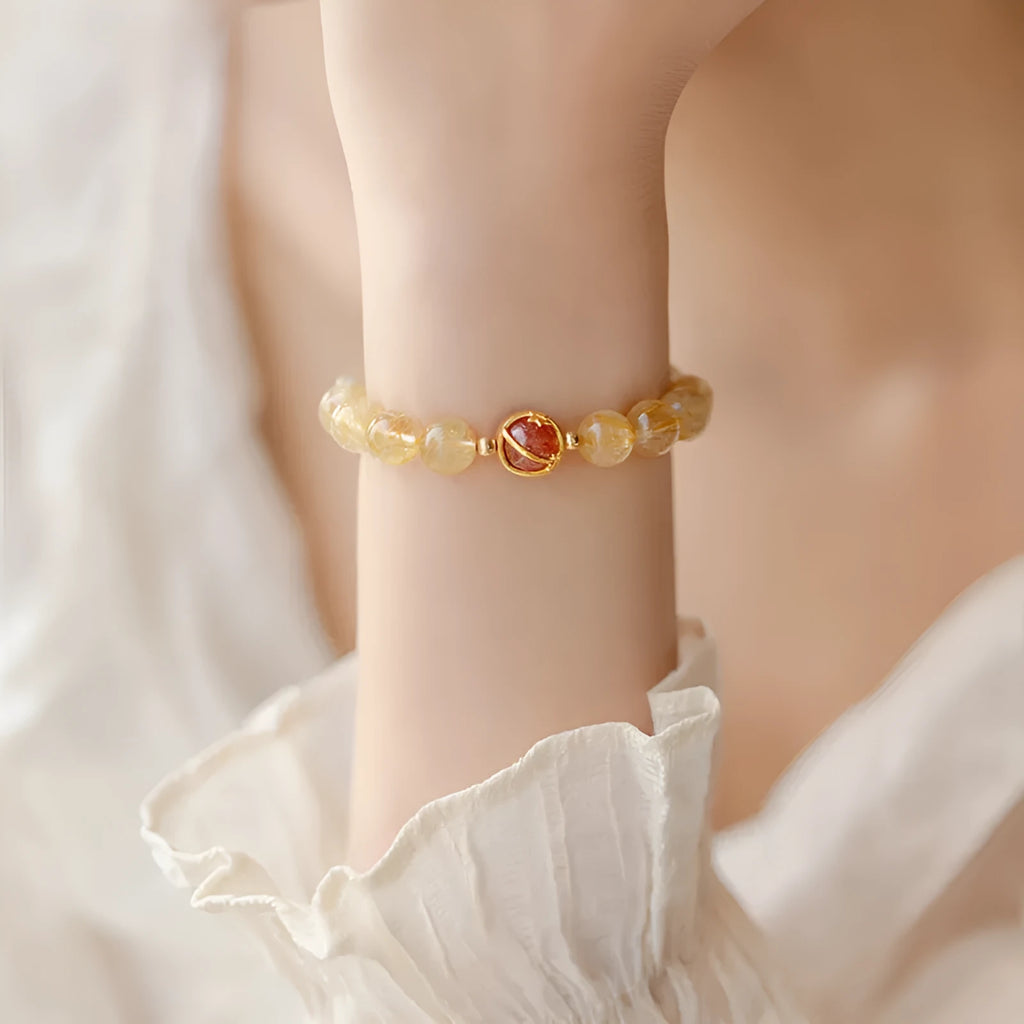 Gold rutilated quartz crystal bracelet with diamond shaped beads in Korean style design