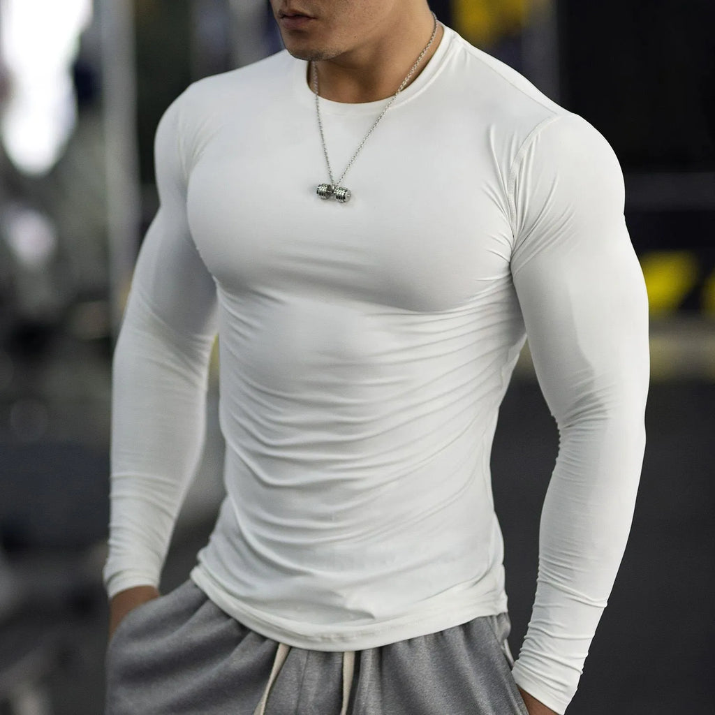 Men's black fitness tights with long sleeves and slim fit for running and gym workouts