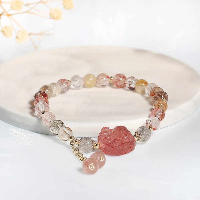Women's natural crystal bracelet with manual craftsmanship showing animal zodiac designs