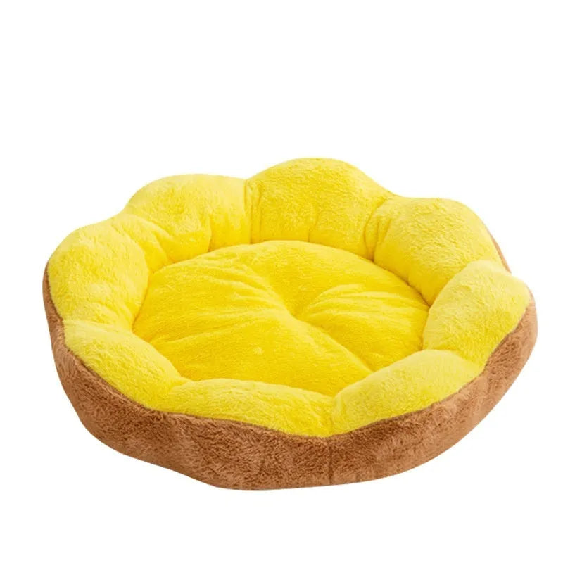 Soft plush round cat bed with a removable cover in a brown grey colour, shown on a floor.