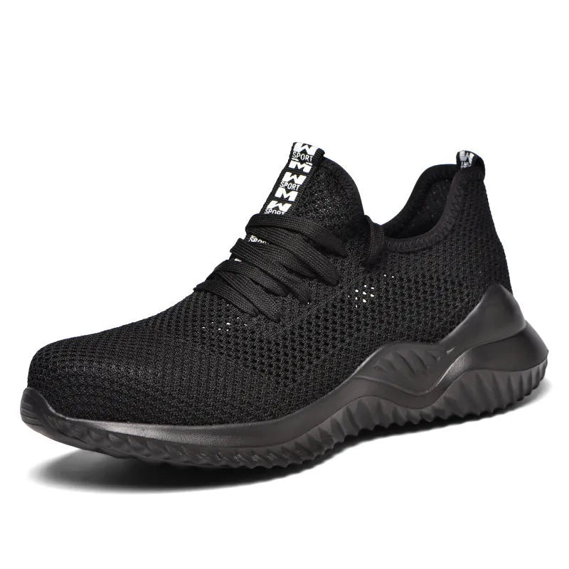 Men's black steel toe cap safety shoes with a low-cut design on a work surface.