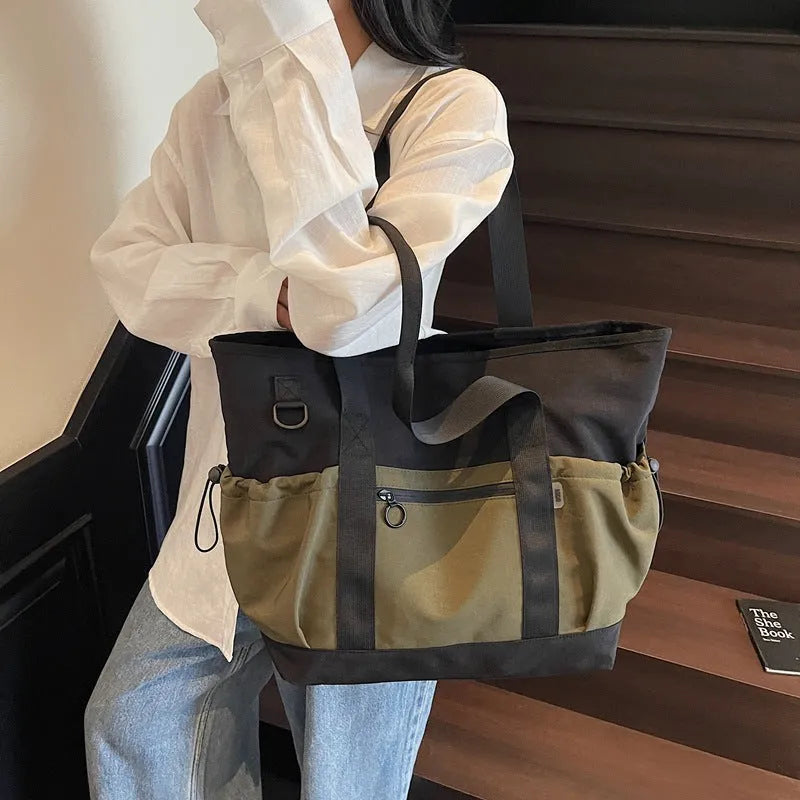 Grey women's lightweight Oxford cloth travel holdall for yoga and fitness.