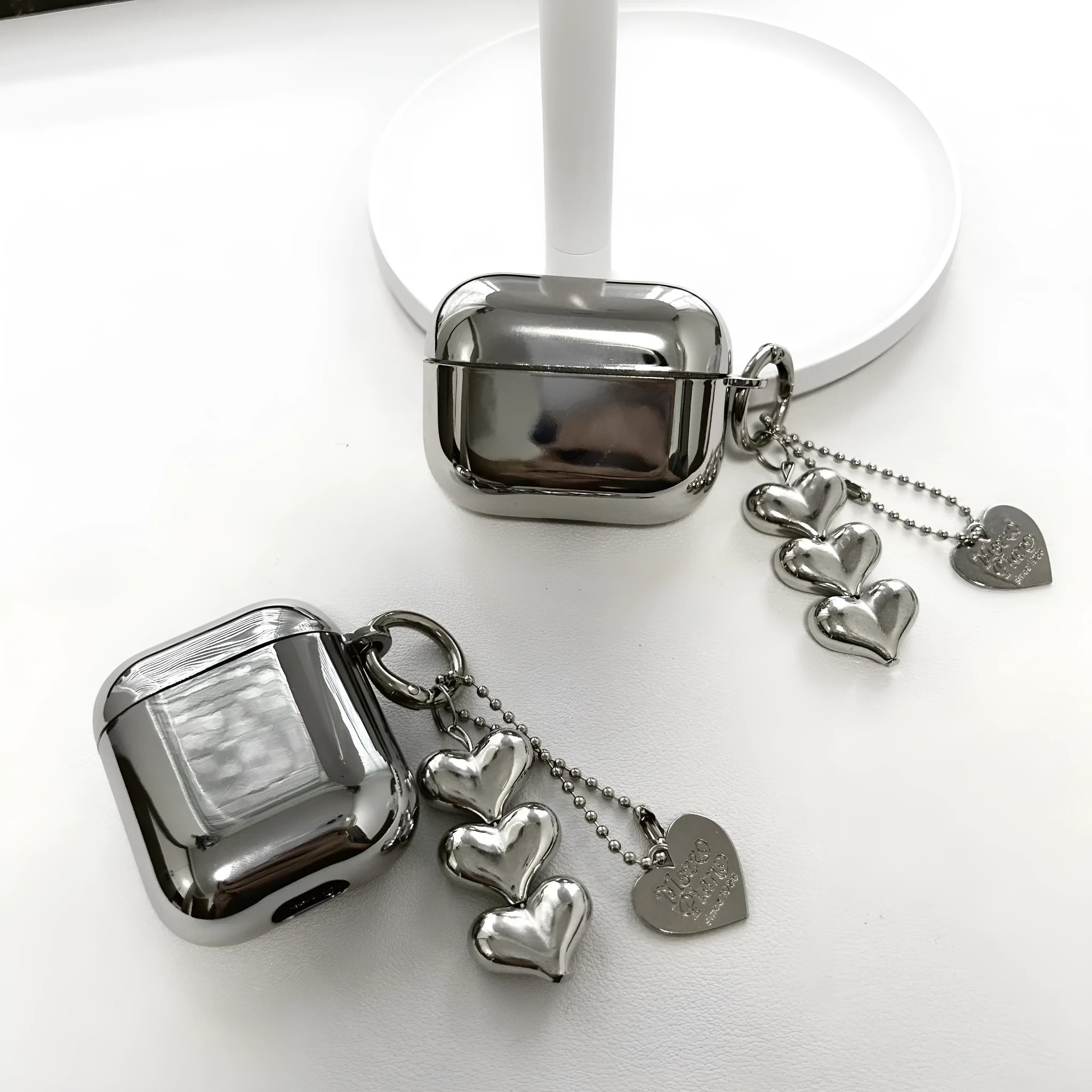 Electroplated solid colour heart pendant design TPU case for AirPods with a carrying chain attached