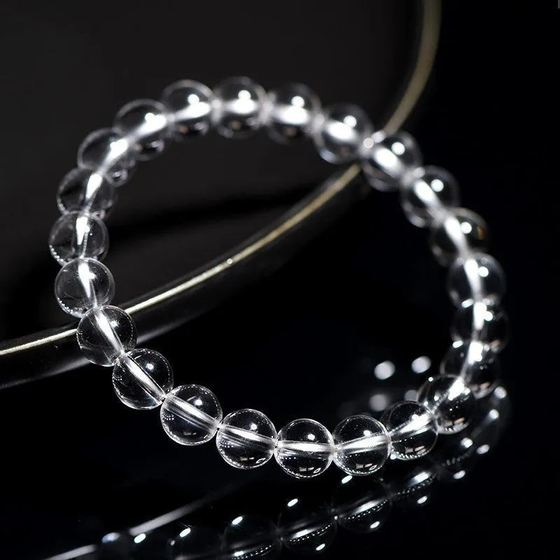 Natural white crystal bracelet with Donghai water round beads showing geometry design on wrist
