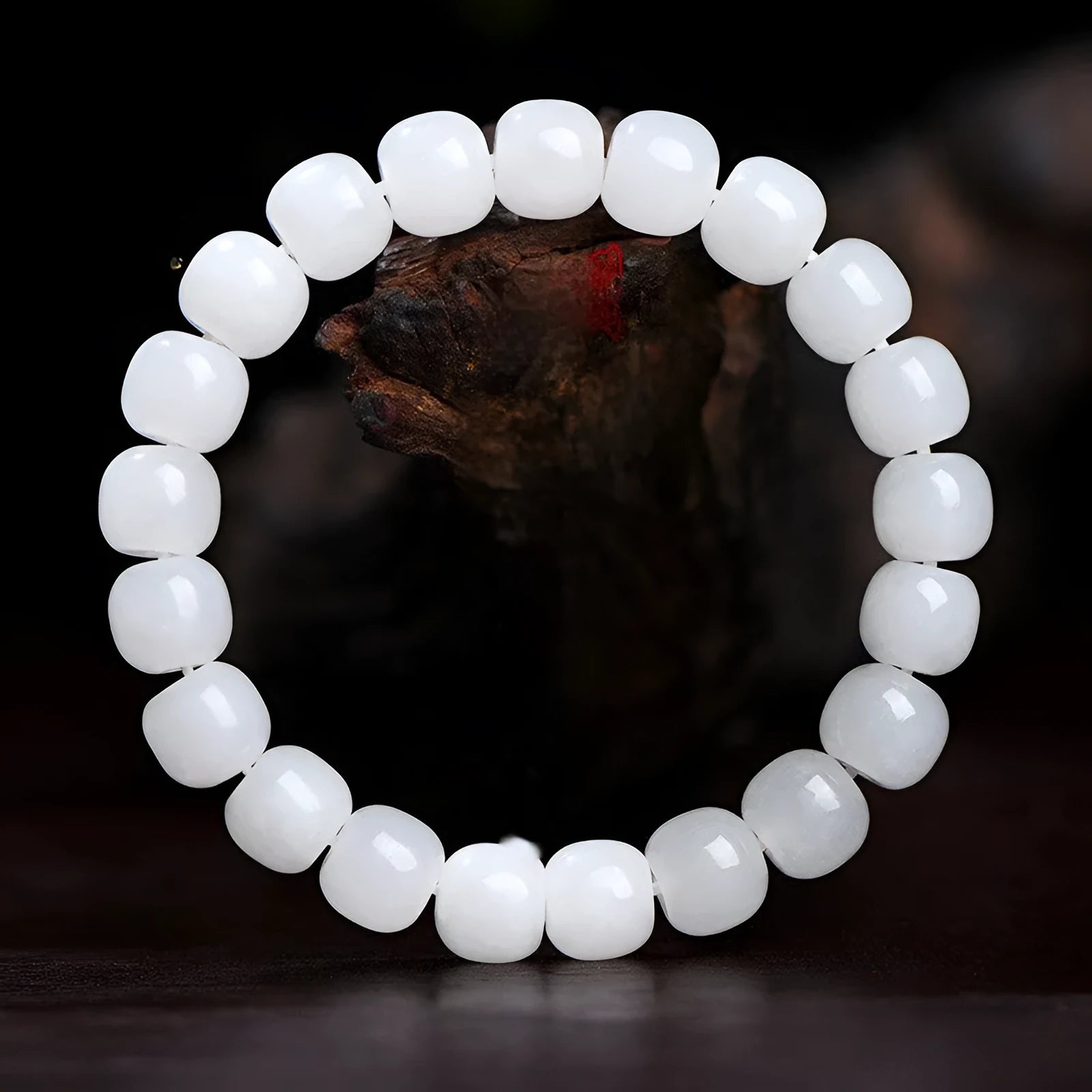 White Hetian jade barrel bead bracelet for men and women, shown in a casual style.