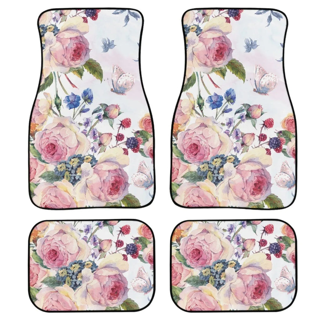 Four-piece set of black printed rubber car floor mats with textured surface.