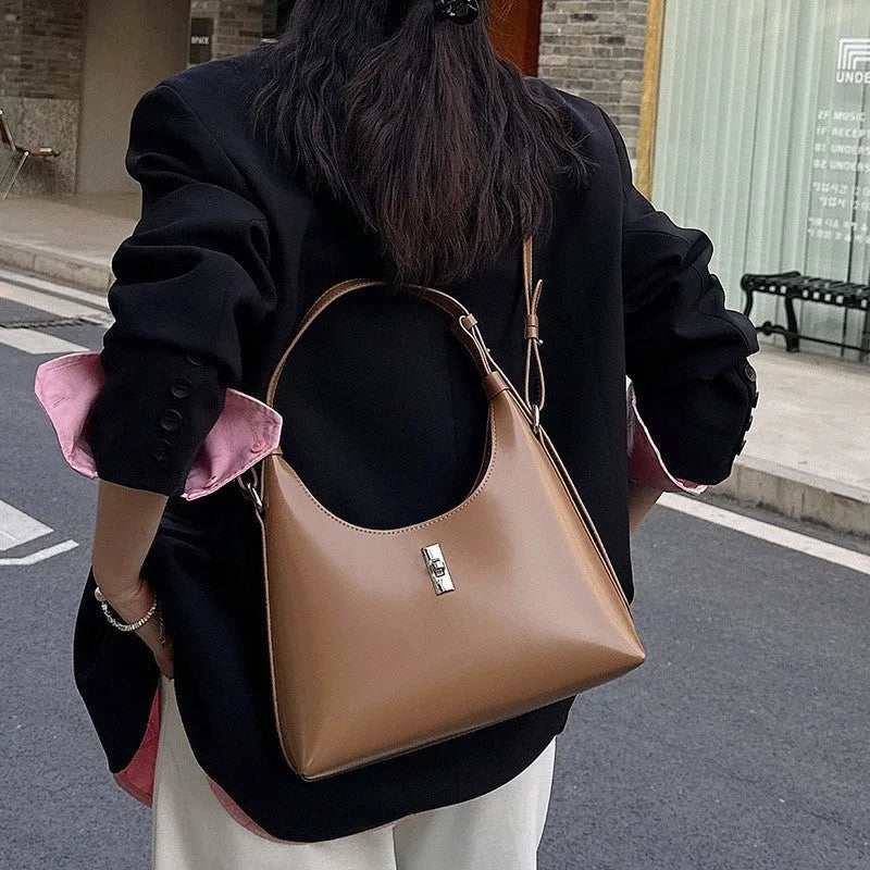 Genuine cowhide leather crossbody shoulder bag in dumpling shape with sandwich pocket and six colour options