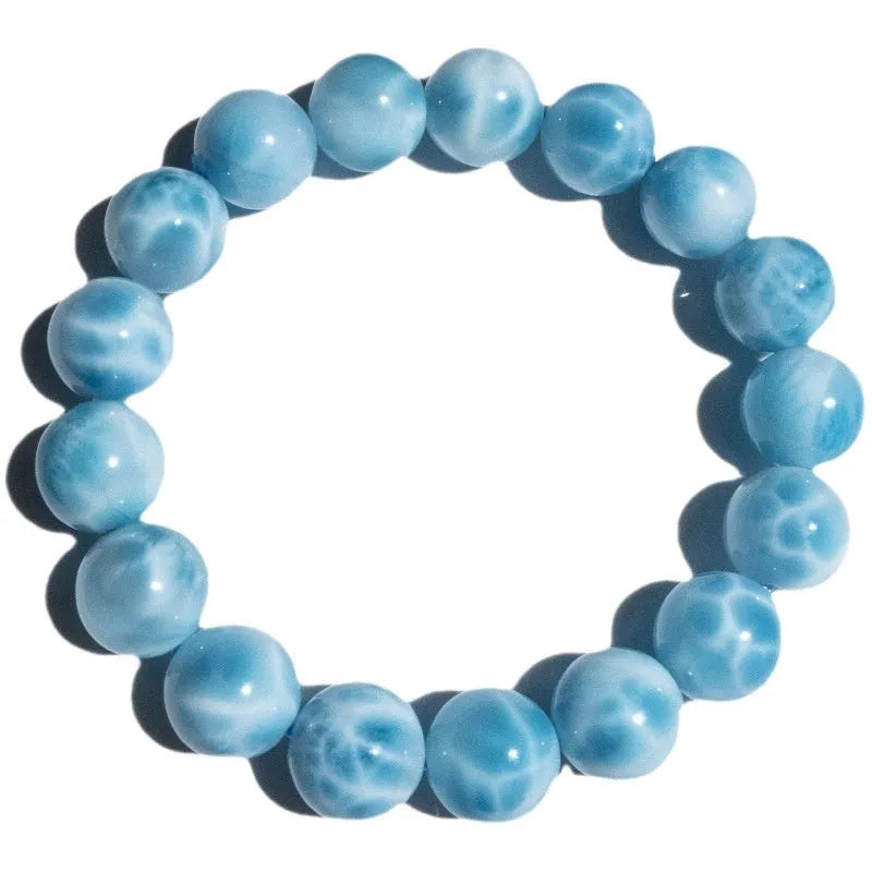 Blue unisex Bodhi bracelet with natural crystal sea-pattern stones and pearls in Maillard style.