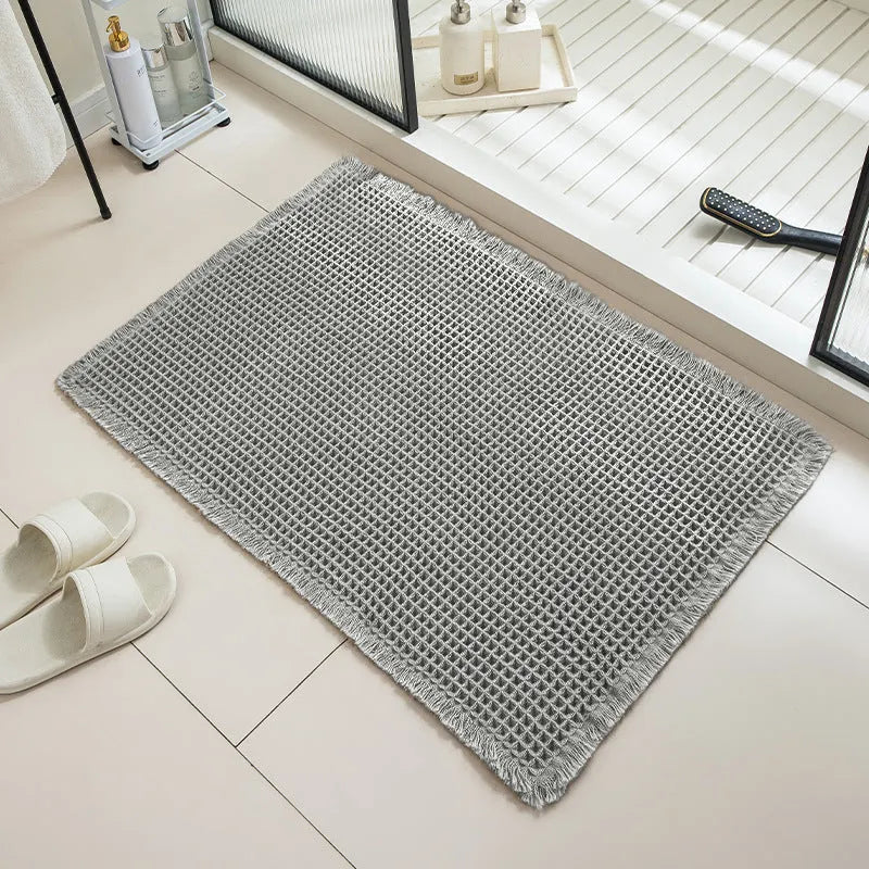 Checkered non-slip bathroom floor carpet in beige, available in multiple sizes from 43x61cm to 61x183cm