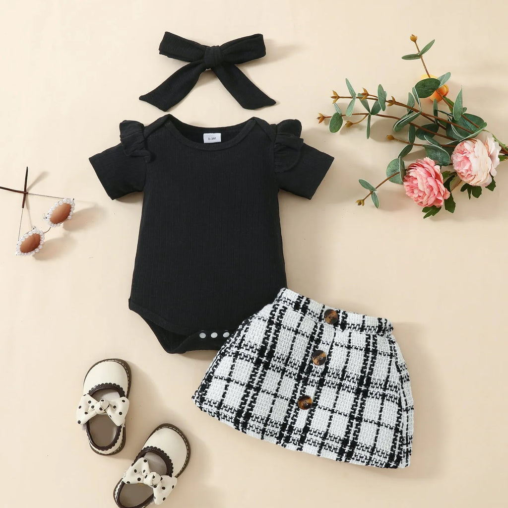 Babies' short-sleeved blouse skirt suit in black with plaid pattern, including romper, skirt and hairband