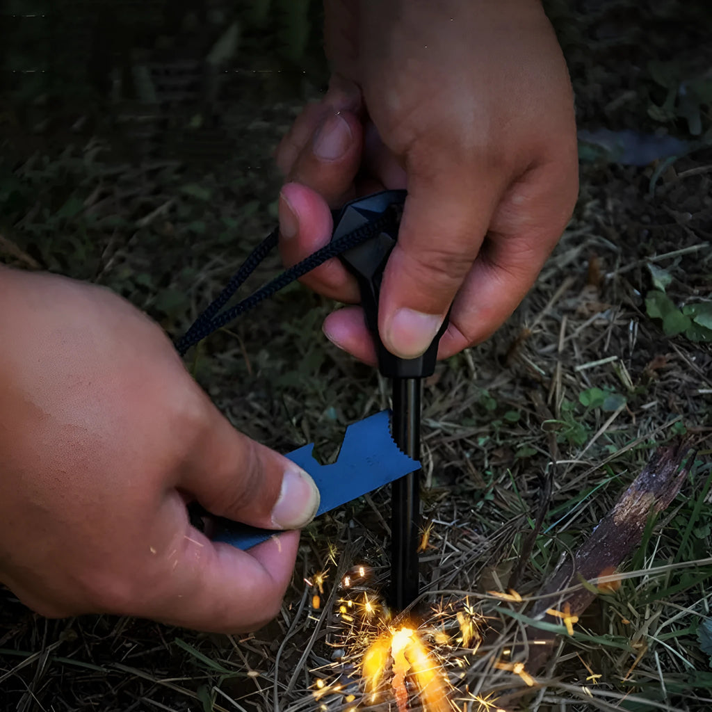 Black outdoor multifunctional flint with magnesium rod, stainless steel scraper, and survival whistle.