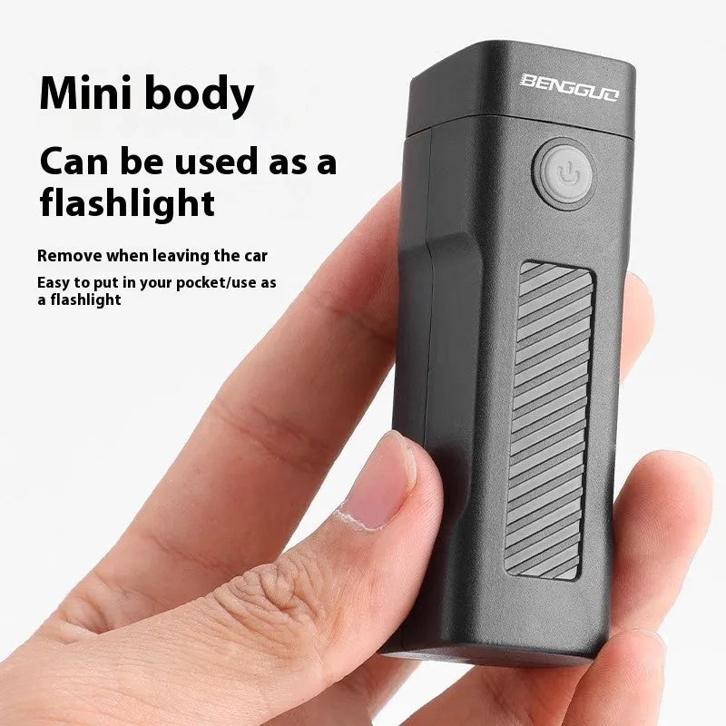 Black USB rechargeable bicycle headlight with quick release strap bracket on handlebars