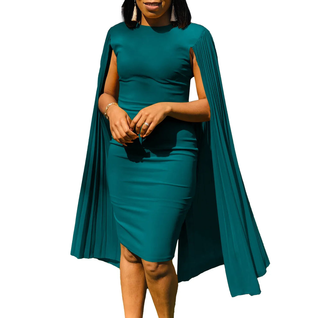 A yellow high-waisted long sleeve evening gown with a round neck and pleated skirt, laid flat.