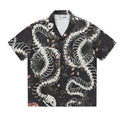 Short sleeve Cuban collar shirt featuring a printed snake bone and flower pattern in a loose fit.