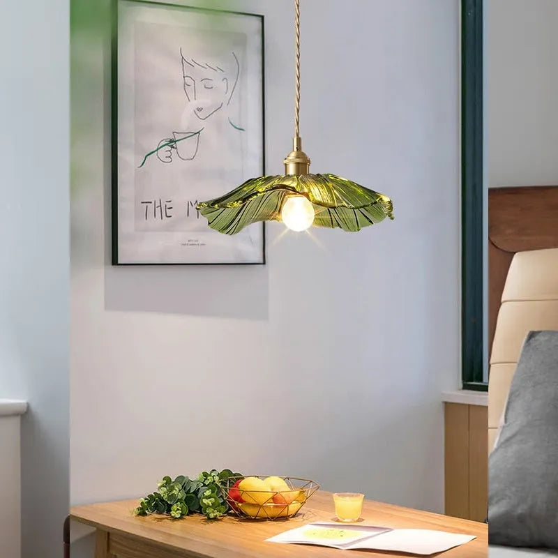 Nordic Japanese style lotus leaf shaped ceiling or pendant lamp with iron frame and glass shade.