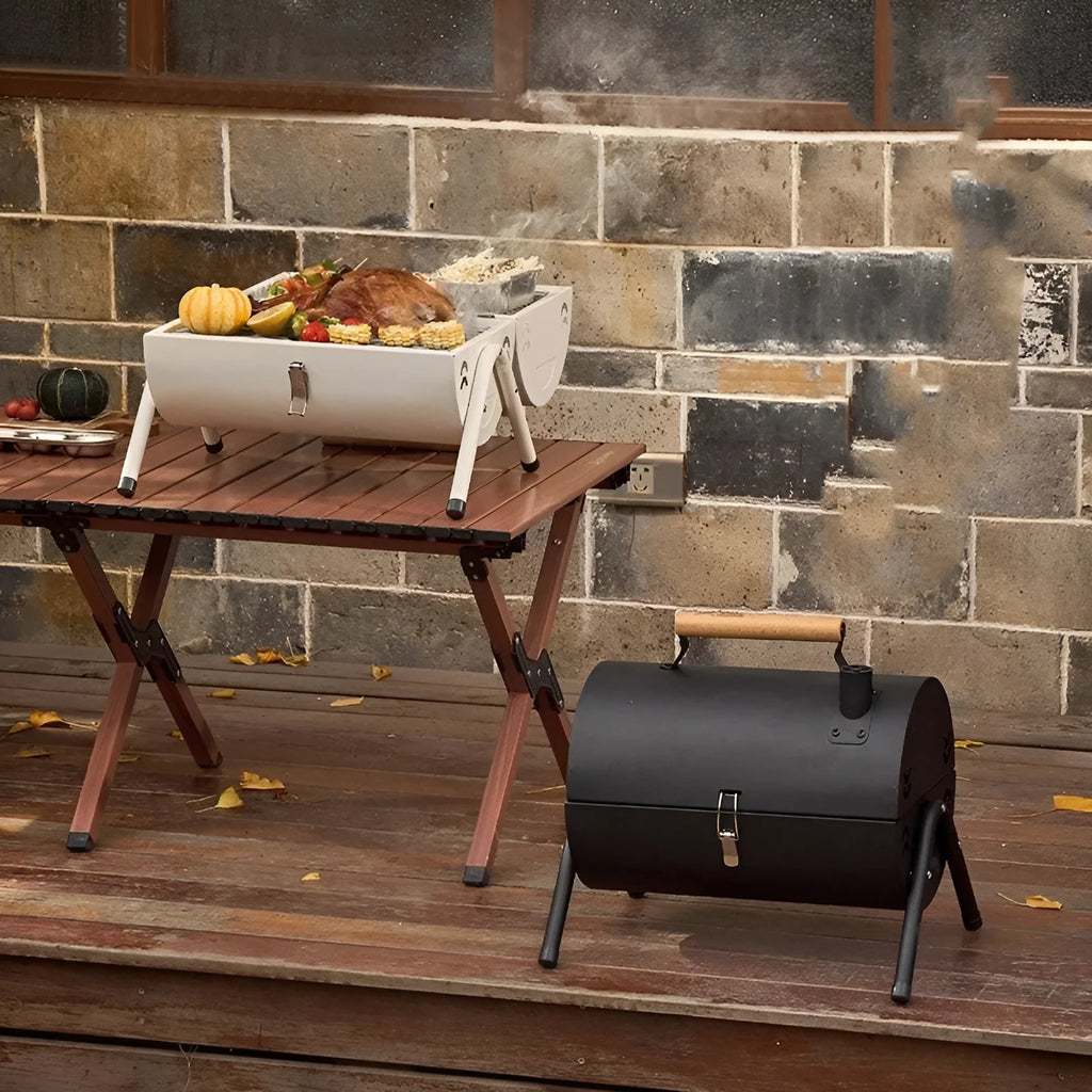 White round chimney oven style portable folding grill for frying and baking outdoors.