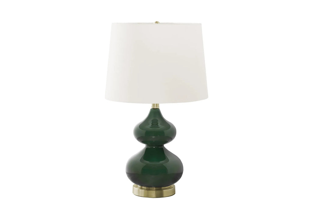 Blue crystal glass desk lamp with white fabric shade on a wooden desk.