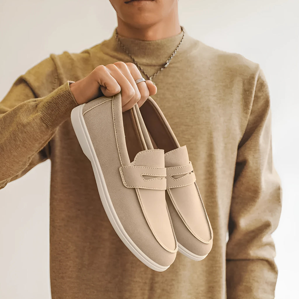 Men's suede leather slip-on casual shoe in a solid colour with a round toe and low flat heel.