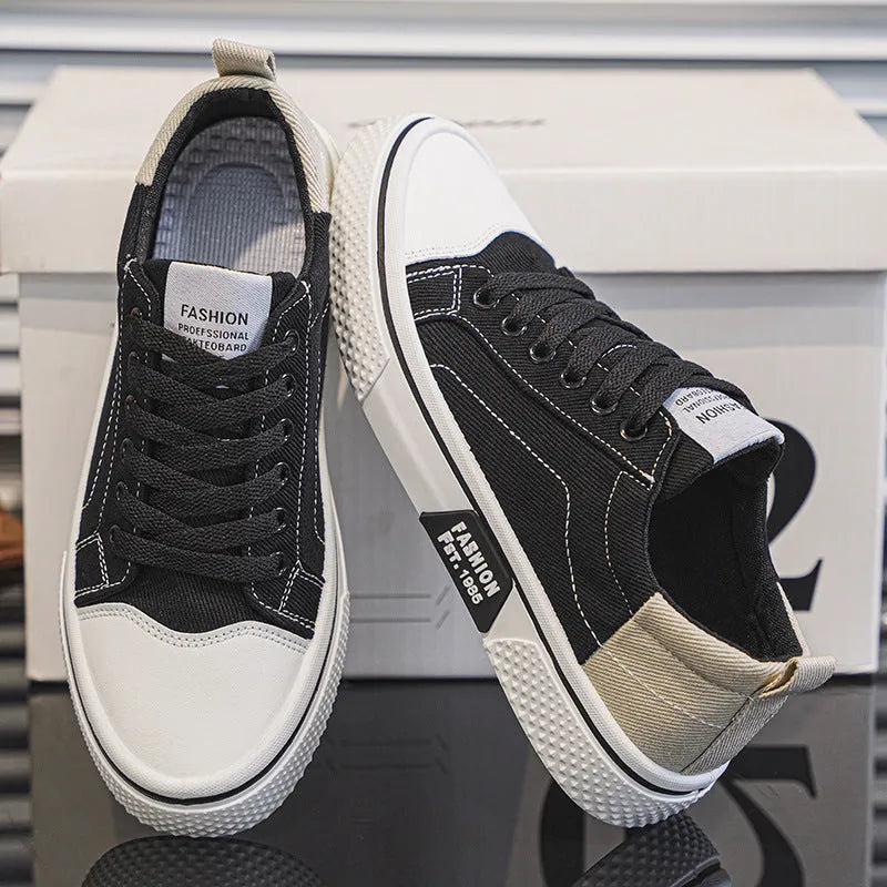 Men's low-top canvas skate shoes in blue with lace-up front and white PVC sole