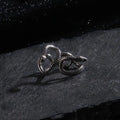 Retro snake-shaped alloy ear clip with electroplated finish on a neutral background