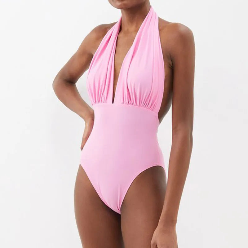 Women's backless halter neck one-piece swimsuit with matching skirt in flower pattern colour