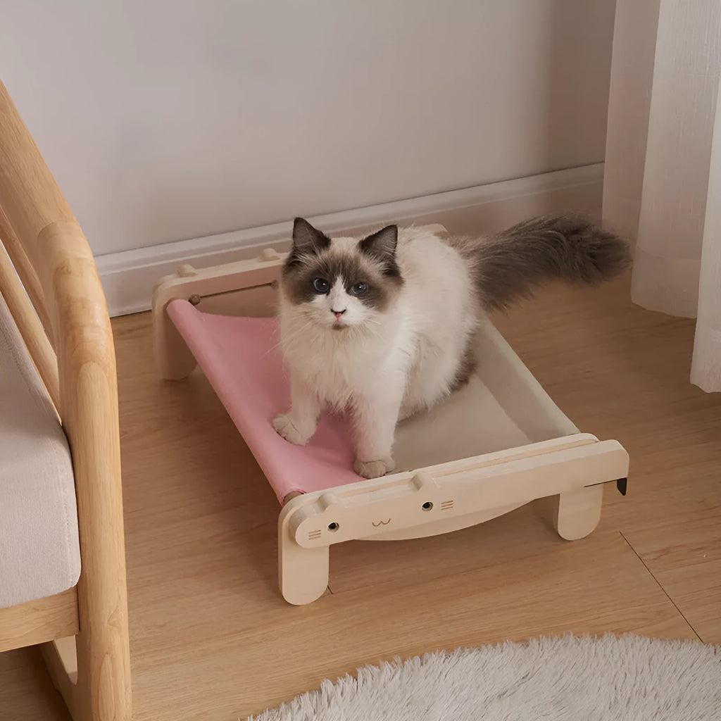 Solid wood cat bed with a removable fabric cover, shown in a grey colour option.