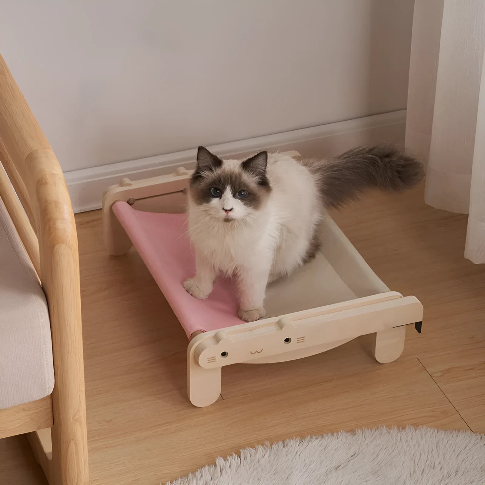Solid wood cat bed with a removable fabric cover, shown in a grey colour option.