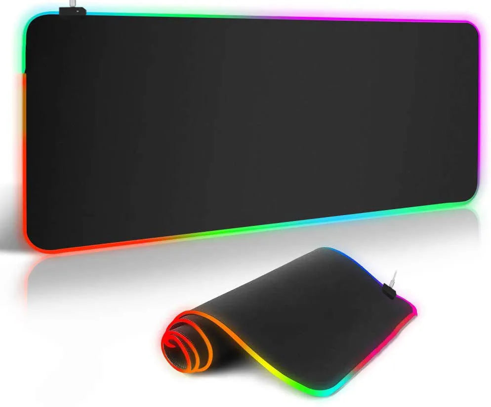 Symphony RGB luminous oversized mouse pad with USB cable on a desk, showing illuminated pattern and anti-slip rubber base.