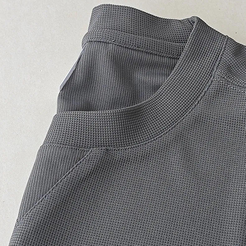 Men's heavyweight waffle-knit short-sleeved t-shirt in a solid colour, showing textured fabric detail.