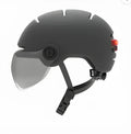 Cycling helmet with integrated LED brake and tail lights in M and L sizes