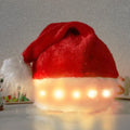 Red and white plush Santa hat with multicoloured LED lights glowing around brim and pom-pom decoration