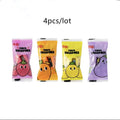 Four fruit and vegetable shaped mini pencil sharpeners in random colours on a light surface