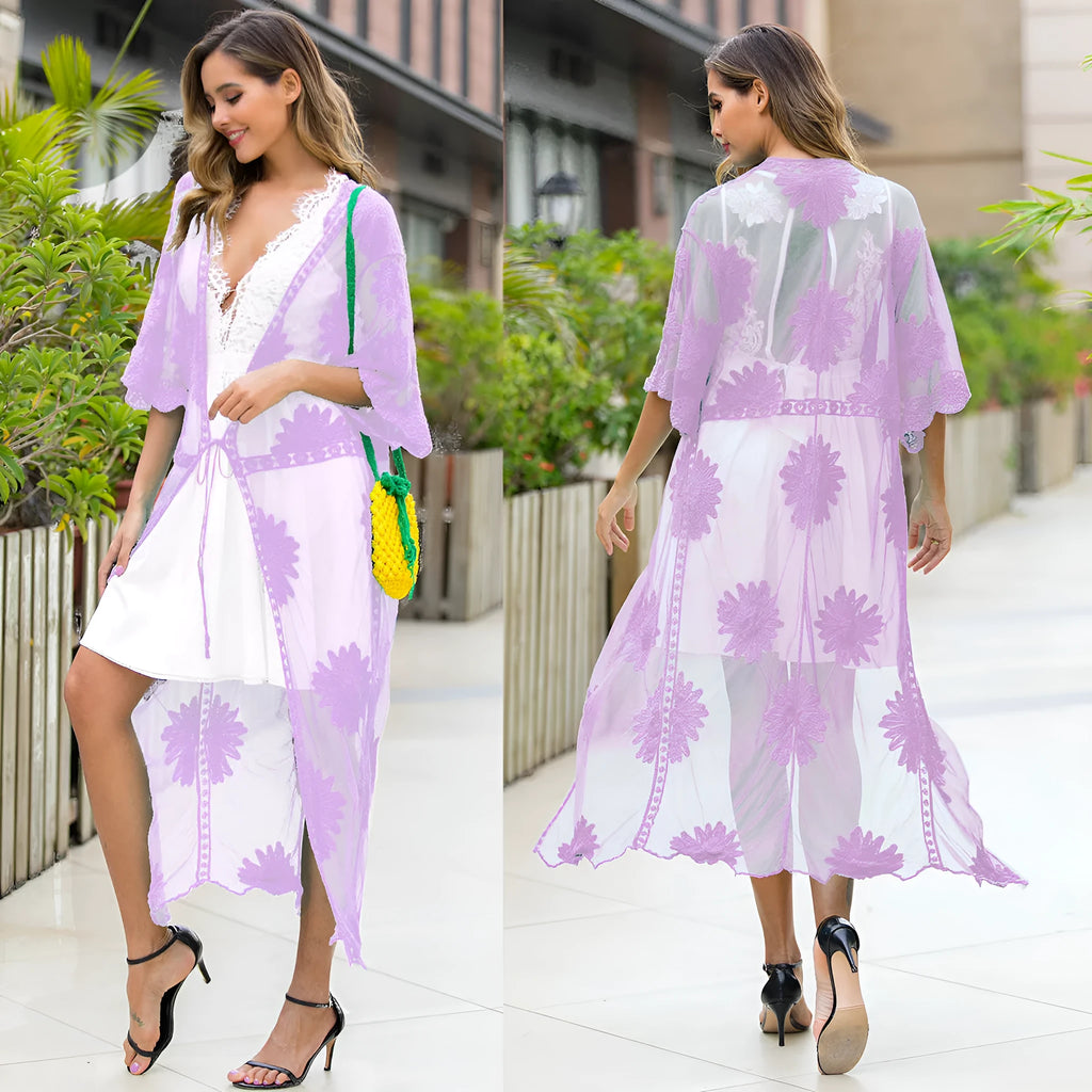 Light purple women's beach dress with lace embroidery, worn as a swimsuit cover-up.
