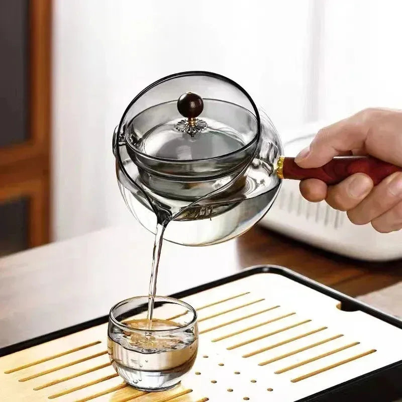 Transparent borosilicate glass teapot with wooden handle and removable infuser for rotary tea brewing