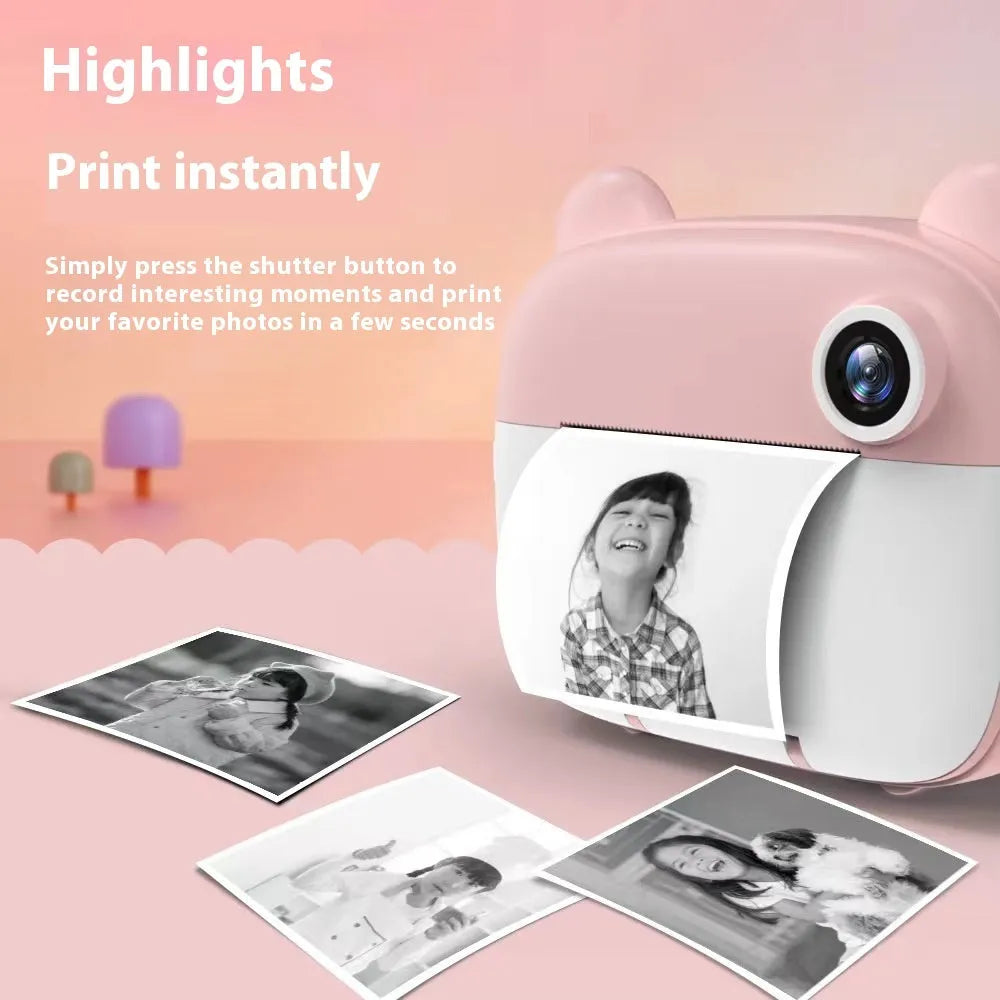 Pink children's handheld SLR toy camera with double lens on a table.