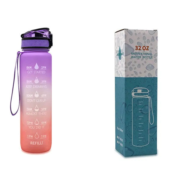Blue and red gradient 1 litre Tritan sports water bottle with time markers and a black flip-top lid.