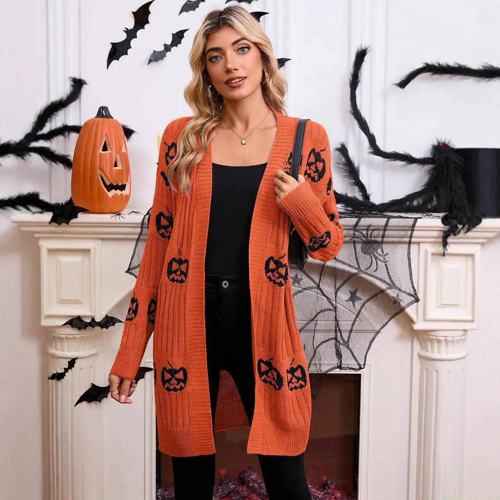 Women's black Halloween cardigan with orange Jacquard knitted pumpkin head pattern, shown as an open medium-length knit.
