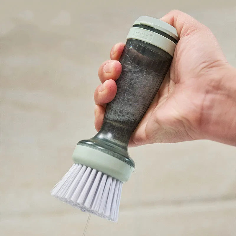 Pot and dish brush with soap dispenser, ergonomic handle, and replaceable brush head in mint green colour
