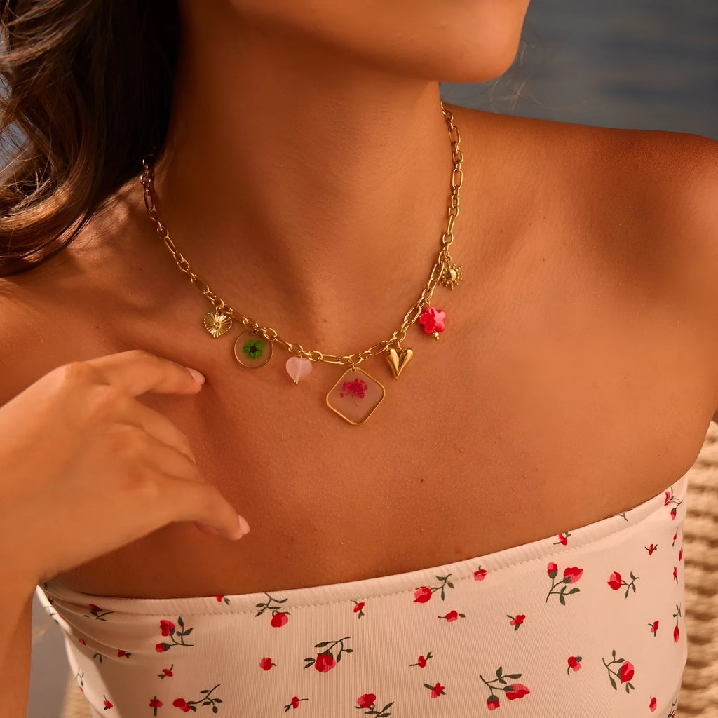 Stainless steel necklace with geometric epoxy flower pendant and 18K gold electroplated finish on a regular chain