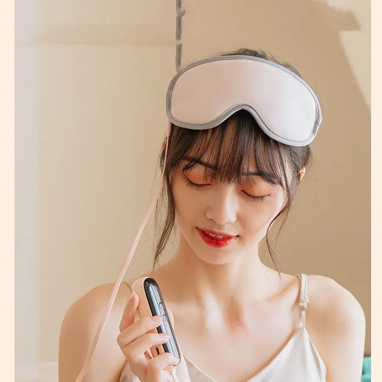 Portable eye SPA massage goggles showing super fibre material and suede shell, with USB cable connection for heating and vibration functions