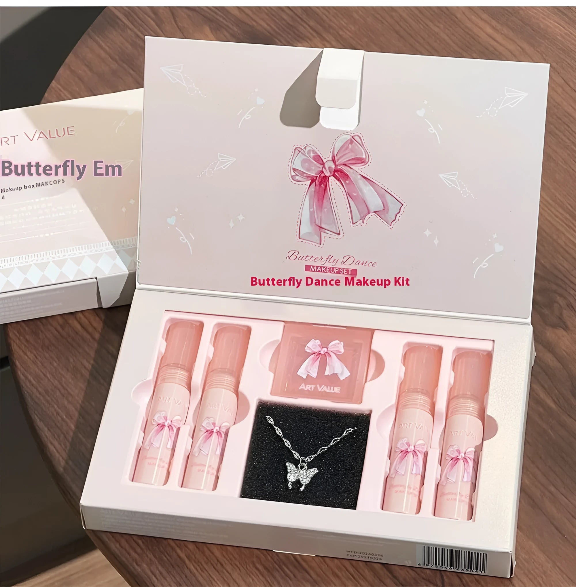 Butterfly Box makeup set showing pink lip muds, blush and butterfly necklace