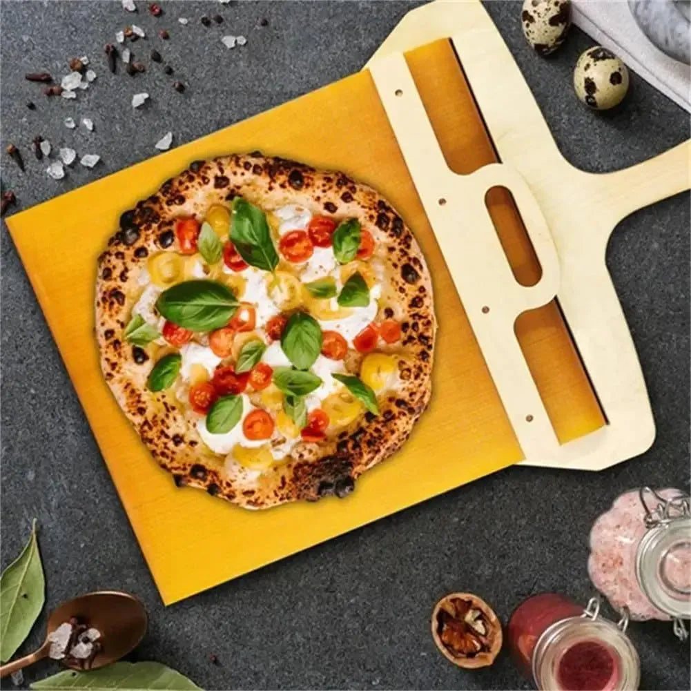 White food-grade PP plastic pizza transfer shovel with handle and hanging hole.