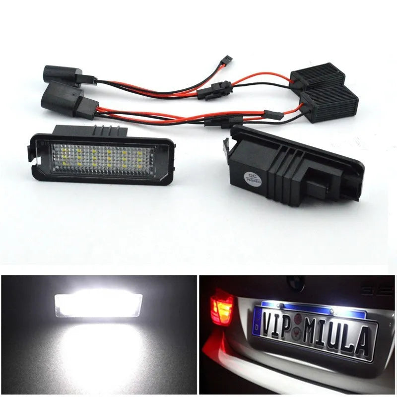 Two Volkswagen LED license plate light bulbs with SMD LEDs and plug connectors.