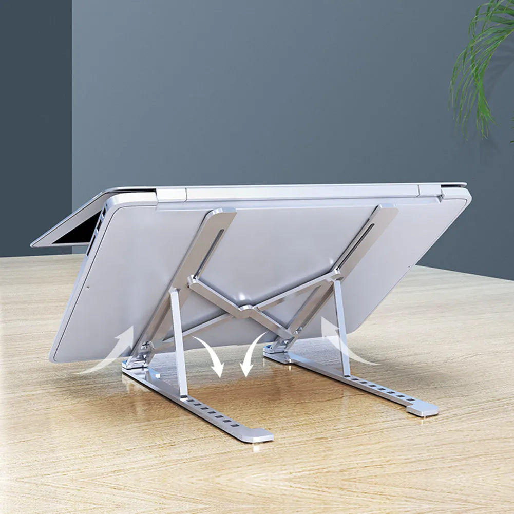 Foldable aluminium laptop stand in silver, shown open at an angle and folded flat.